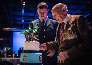 Ron Hermanns cuts his 108th birthday cake at the New Zealand Air Force Museum in Christchurch