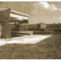 The guns at Castor Bay. In the background is the fire control/observation post, also cunningly disguised as a suburban house. It is currently available for hire for functions