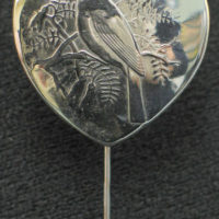 A tui bird from a NZ sixpence (New Zealand Air Force Museum)